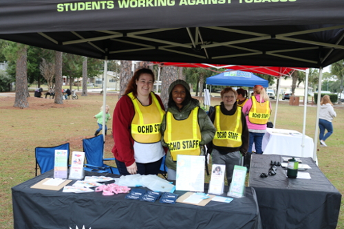 Staff at table at Family Field Day